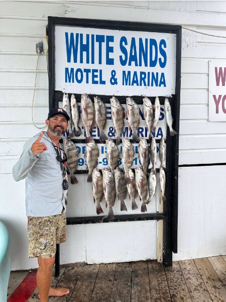 Large fish stringer on the White Sands cleaning board.