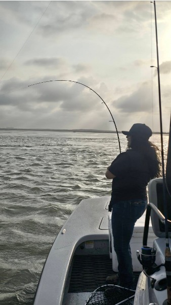 Sunset hookup with a deeply bowed rod.
